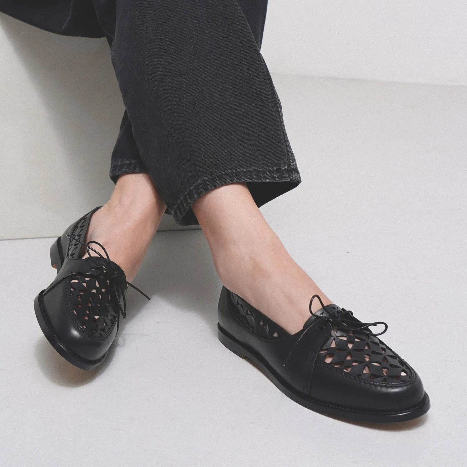 Delirium black laser cut leather loafer